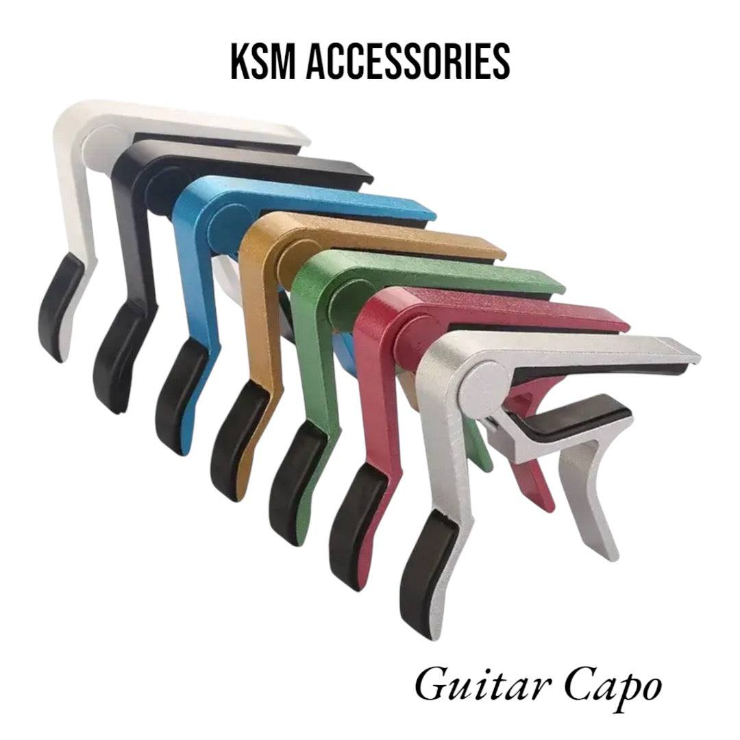 Quick-change guitar capo on acoustic guitar neck
