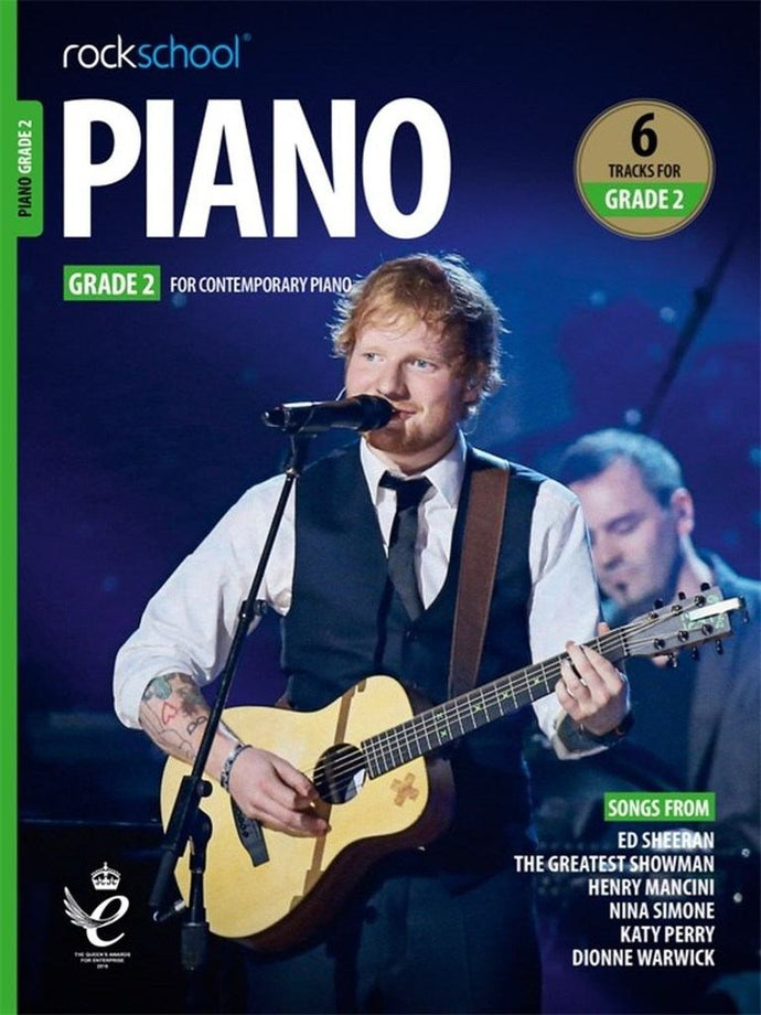 ROCKSCHOOL PIANO GRADE 2 book cover featuring a musician with guitar; includes tracks from Ed Sheeran and more.